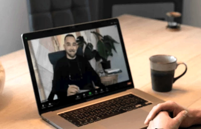 Ernesto holding an online therapy session with a client